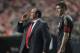 LISBON, PORTUGAL - APRIL 01: Manager Rafael Benitez (L) of Liverpool issues instructions as Steven Gerrard looks on during the UEFA Europa League, first leg quarter final match between Benfica and Liverpool at the Estadio de Luz Stadium on April 1, 2010