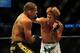 Jul 21, 2012; Calgary, AB, CANADA; Renan Barao (blue golves) and Urijah Faber (red gloves) during the interim bantamweight title bout of UFC 149 at the Scotiabank Saddledome. Mandatory Credit: Anne-Marie Sorvin-USA TODAY Sports