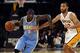 Jan 5, 2014; Los Angeles, CA, USA; Denver Nuggets guard Ty Lawson (3) drives the ball defended by Los Angeles Lakers guard Kendall Marshall (12) during the first period at Staples Center. Mandatory Credit: Kelvin Kuo-USA TODAY Sports