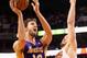 PHOENIX, AZ - JANUARY 15: Pau Gasol #16 of the Los Angeles Lakers attempts a shot over Miles Plumlee #22 of the Phoenix Suns during the first half of the NBA game at US Airways Center on January 15, 2014 in Phoenix, Arizona. The Suns defeated the Lakers