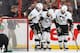 OTTAWA, ON - DECEMBER 23: Pascal Dupuis #9 of the Pittsburgh Penguins is helped off the ice by team mates Matt Niskanen #2 and Chris Kunitz #14 after colliding with his own player during an NHL game against the Ottawa Senators at Canadian Tire Centre on D