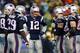 FOXBORO, MA - JANUARY 11: Tom Brady #12 of the New England Patriots talks with his teammates in a huddle against the Indianapolis Colts during the AFC Divisional Playoff game at Gillette Stadium on January 11, 2014 in Foxboro, Massachusetts. (Photo by