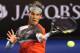 MELBOURNE, AUSTRALIA - JANUARY 18: Rafael Nadal of Spain plays a forehand in his third round match against Gael Monfils of France during day six of the 2014 Australian Open at Melbourne Park on January 18, 2014 in Melbourne, Australia. (Photo by Michael