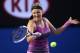 MELBOURNE, AUSTRALIA - JANUARY 18: Victoria Azarenka of Belarus plays a forehand in her third round match against Yvonne Meusburger of Austria during day six of the 2014 Australian Open at Melbourne Park on January 18, 2014 in Melbourne, Australia. (Pho
