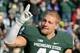 EAST LANSING, MI - NOVEMBER 30: Max Bullough #40 of the Michigan State Spartans waves to the crowd during player introductions prior to the game against the Minnesota Golden Gophers at Spartan Stadium on November 30, 2013 in East Lansing, Michigan. The S