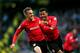 MANCHESTER, ENGLAND - JANUARY 18: Craig Noone (L) of Cardiff is congratulated by teammate Fraizer Campbell (R) after scoring a goal to level the scores at 1-1 during the Barclays Premier League match between Manchester City and Cardiff City at the Etihad