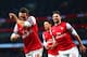 LONDON, ENGLAND - JANUARY 18: Santi Cazorla of Arsenal (L) celebrates with Olivier Giroud (R) as he scores their first goal during the Barclays Premier League match between Arsenal and Fulham at Emirates Stadium on January 18, 2014 in London, England. (