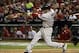 Oct 27, 2013; St. Louis, MO, USA; Boston Red Sox shortstop Stephen Drew drives in a run with a sacrifice fly against the St. Louis Cardinals in the fifth inning during game four of the MLB baseball World Series at Busch Stadium. Mandatory Credit: H.Darr B