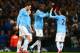 MANCHESTER, ENGLAND - JANUARY 08: Yaya Toure of Manchester City celebrates scoring their third goal with David Silva of Manchester City during the Capital One Cup Semi-Final first leg match between Manchester City and West Ham United at Etihad Stadium on