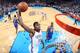 OKLAHOMA CITY, OK - JANUARY 17: Kevin Durant #35 of the Oklahoma City Thunder dunks over Marreese Speights #5 of the Golden State Warriors during an NBA game on January 17, 2014 at the Chesapeake Energy Arena in Oklahoma City, Oklahoma. Durant had a care