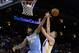 OAKLAND, CA - JANUARY 15: Wilson Chandler #21 of the Denver Nuggets blocks a shot taken by David Lee #10 of the Golden State Warriors at ORACLE Arena on January 15, 2014 in Oakland, California. NOTE TO USER: User expressly acknowledges and agrees that, b