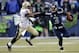 SEATTLE, WA - JANUARY 11: Quarterback Russell Wilson #3 of the Seattle Seahawks pushes back strong safety Roman Harper #41 of the New Orleans Saints in the fourth quarter while taking on the New Orleans Saints during the NFC Divisional Playoff Game at Ce
