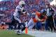 DENVER, CO - JANUARY 12: Wes Welker #83 of the Denver Broncos scores a second quarter touchdown against the defense of Darrell Stuckey #25 of the San Diego Chargers during the AFC Divisional Playoff Game at Sports Authority Field at Mile High on January