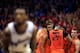 LAWRENCE, KS - JANUARY 18: Markel Brown #22 and the Oklahoma State Cowboys huddle as Naadir Tharpe #10 of the Kansas Jayhawks shoots a free throw after a technical foul during the game at Allen Fieldhouse on January 18, 2014 in Lawrence, Kansas. (Photo