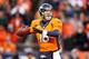 DENVER, CO - JANUARY 12: Peyton Manning #18 of the Denver Broncos looks to pass during the AFC Divisional Playoff Game against the San Diego Chargers at Sports Authority Field at Mile High on January 12, 2014 in Denver, Colorado. (Photo by Christian Pet