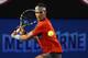MELBOURNE, AUSTRALIA - JANUARY 18: Rafael Nadal of Spain plays a backhand in his third round match against Gael Monfils of France during day six of the 2014 Australian Open at Melbourne Park on January 18, 2014 in Melbourne, Australia. (Photo by Cameron