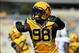 Sep 28, 2013; Morgantown, WV, USA; West Virginia Mountaineers defensive lineman Will Clarke (98) celebrates after a stop during the first half against the Oklahoma State Cowboys at Milan Puskar Stadium. Mandatory Credit: Peter Casey-USA TODAY Sports