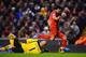 LIVERPOOL, ENGLAND - JANUARY 18: Luis Suarez of Liverpool goes to ground after a challenge by Brad Guzan of Aston Villa leading to a penalty during the Barclays Premier League match between Liverpool and Aston Villa at Anfield on January 18, 2014 in Live