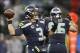 Jan 11, 2014; Seattle, WA, USA; Seattle Seahawks quarterback Russell Wilson (3) passes the football against the New Orleans Saints during the second half of the 2013 NFC divisional playoff football game at CenturyLink Field. Mandatory Credit: Joe Nicholso