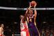TORONTO, CANADA - January 19: Ryan Kelly #4 of the Los Angeles Lakers goes up for the layup against the Toronto Raptors during the game on January 19, 2014 at the Air Canada Centre in Toronto, Ontario, Canada. NOTE TO USER: User expressly acknowledges an