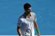 MELBOURNE, AUSTRALIA - JANUARY 19: Novak Djokovic of Serbia looks on in his fourth round match against Fabio Fognini of Italy after Fogini threw his racquet over the net to Djokovic during day seven of the 2014 Australian Open at Melbourne Park on Januar