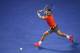 MELBOURNE, AUSTRALIA - JANUARY 18: Rafael Nadal of Spain runs to play a backhand during his straight sets victory in his third round match against Gael Monfils of France during day six of the 2014 Australian Open at Melbourne Park on January 18, 2014 in