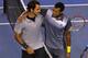 MELBOURNE, AUSTRALIA - JANUARY 23: Roger Federer of Switzerland and Jo-Wilfred Tsonga of France shake hands after Federer won their Quarterfinal match during day ten of the 2013 Australian Open at Melbourne Park on January 23, 2013 in Melbourne, Austral