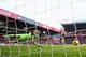 LONDON, ENGLAND - JANUARY 18: Goalkeeper Jack Butland of Stoke City dives in vain as Jason Puncheon of Crystal Palace (blocked) scores the opening goal during the Barclays Premier League match between Crystal Palace and Stoke City at Selhurst Park on Janu