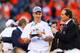 DENVER, CO - JANUARY 19: Peyton Manning #18 of the Denver Broncos celebrates with the Lamar Hunt Trophy after they defeated the New England Patriots 26 to 16 in the AFC Championship game at Sports Authority Field at Mile High on January 19, 2014 in Denv