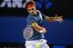 MELBOURNE, AUSTRALIA - JANUARY 20: Roger Federer of Switzerland plays a forehand in his fourth round match against Jo-Wilfried Tsonga of France during day eight of the 2014 Australian Open at Melbourne Park on January 20, 2014 in Melbourne, Australia. (