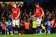 LONDON, ENGLAND - JANUARY 19: (L-R) Dejected Manchester United players Phil Jones and Michael Carrick on after conceding a second goal during the Barclays Premier League match between Chelsea and Manchester United at Stamford Bridge on January 19, 2014 i
