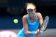 MELBOURNE, AUSTRALIA - JANUARY 19: Ana Ivanovic of Serbia plays a backhand in her fourth round match against Serena Williams of the United States during day seven of the 2014 Australian Open at Melbourne Park on January 19, 2014 in Melbourne, Australia.