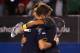 MELBOURNE, AUSTRALIA - JANUARY 20: Novak Djokovic of Serbia embraces Stanislas Wawrinka of Switzerland after winning his fourth round match against during day seven of the 2013 Australian Open at Melbourne Park on January 20, 2013 in Melbourne, Australia