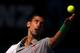 MELBOURNE, AUSTRALIA - JANUARY 19: Novak Djokovic of Serbia serves in his fourth round match against Fabio Fognini of Italy during day seven of the 2014 Australian Open at Melbourne Park on January 19, 2014 in Melbourne, Australia. (Photo by Michael Dod