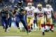 SEATTLE, WA - JANUARY 19: Running back Marshawn Lynch #24 of the Seattle Seahawks runs for a 40-yard touchdown in the third quarter against the San Francisco 49ers during the 2014 NFC Championship at CenturyLink Field on January 19, 2014 in Seattle, Wash