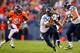 DENVER, CO - AUGUST 18: Running back Marshawn Lynch #24 of the Seattle Seahawks runs through a hole for a first down as linebacker Joe Mays #51 of the Denver Broncos gives chase and offensive guard J.R. Sweezy #64 looks to make a block during the first q
