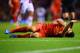 LIVERPOOL, ENGLAND - JANUARY 18: Luis Suarez of Liverpool lies injured during the Barclays Premier League match between Liverpool and Aston Villa at Anfield on January 18, 2014 in Liverpool, England. (Photo by Michael Regan/Getty Images)