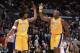 15 Apr 2002: Center Shaquille O''Neal #34 of the Los Angeles Lakers give a high five to his teammate, guard Kobe Bryant #8, during the NBA game against the Seattle SuperSonics at the Staples Center in Los Angeles, California. The Lakers won, 111-104. \ N