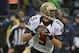 Jan 11, 2014; Seattle, WA, USA; New Orleans Saints quarterback Drew Brees (9) looks for a receiver against the Seattle Seahawks during the first half of the 2013 NFC divisional playoff football game at CenturyLink Field. Mandatory Credit: Kirby Lee-USA TO