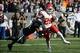 December 15, 2013; Oakland, CA, USA; Kansas City Chiefs running back Jamaal Charles (25) runs past Oakland Raiders free safety Charles Woodson (24) during the first quarter at O.co Coliseum. Mandatory Credit: Kyle Terada-USA TODAY Sports