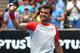 MELBOURNE, AUSTRALIA - JANUARY 18: Grigor Dimitrov of Bulgaria celebrates winning his third round match against Milos Raonic of Canada during day six of the 2014 Australian Open at Melbourne Park on January 18, 2014 in Melbourne, Australia. (Photo by Ro