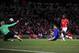 LONDON, ENGLAND - MAY 05: Cristiano Ronaldo of Manchester United shoots and scores the third goal of the game during the UEFA Champions League Semi Final Second Leg match between Arsenal and Manchester United at Emirates Stadium on May 5, 2009 in London,