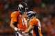 DENVER, CO - SEPTEMBER 23: Peyton Manning #18 and Wes Welker #83 of the Denver Broncos celebrate their second quarter touchdown against the Oakland Raiders at Sports Authority Field at Mile High on September 23, 2013 in Denver, Colorado. (Photo by Jus