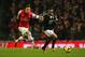 LONDON, ENGLAND - NOVEMBER 23: Nathaniel Clyne of Southampton is pursued by Mesut Oezil of Arsenal during the Barclays Premier League match between Arsenal and Southampton at Emirates Stadium on November 23, 2013 in London, England. (Photo by Clive Rose