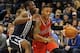 Dec 31, 2013; Oklahoma City, OK, USA; Portland Trail Blazers point guard Damian Lillard (0) handles the ball while being defended by Oklahoma City Thunder point guard Reggie Jackson (15) during the first quarter at Chesapeake Energy Arena. Mandatory Credi