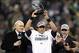 Jan 19, 2014; Seattle, WA, USA; Seattle Seahawks quarterback Russell Wilson hoists the George Halas Trophy after the 2013 NFC Championship football game against the San Francisco 49ers at CenturyLink Field. Mandatory Credit: Joe Nicholson-USA TODAY Sports
