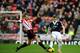 SUNDERLAND, ENGLAND - JANUARY 18: Lee Cattermole of Sunderland stretches to tackle Steven Davis of Southampton during the Barclays Premier League match between Sunderland and Southampton at Stadium of Light on January 18, 2014 in Sunderland, England. (P