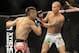 Jan 26, 2013; Chicago, IL, USA; Ricardo Lamas (red and black shorts) fights against Erik Koch (white shorts) during UFC on FOX 6 at the United Center. Mandatory Credit: David Banks-USA TODAY Sports
