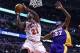 Jan 20, 2014; Chicago, IL, USA; Chicago Bulls shooting guard Jimmy Butler (21) shoots the ball against Los Angeles Lakers power forward Jordan Hill (27) during the second half at United Center. The Bulls defeat the Lakers 102-100 in overtime. Mandatory Cr