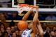 DURHAM, NC - JANUARY 18: Jabari Parker #1 of the Duke Blue Devils dunks over T.J. Warren #24 and Beejay Anya #21 of the North Carolina State Wolfpack during their game at Cameron Indoor Stadium on January 18, 2014 in Durham, North Carolina. Duke won 95-6
